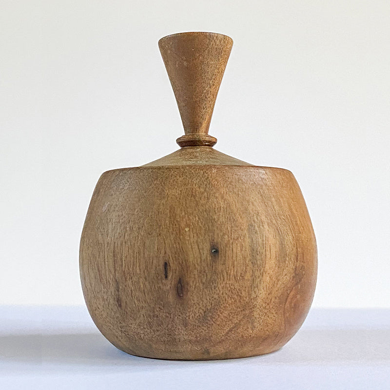 wood in the shape of an apple with a wide top