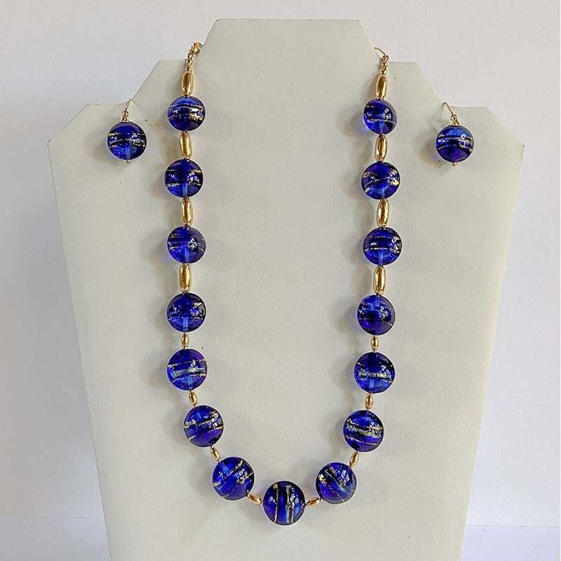 large blue glass balls with gold links in between