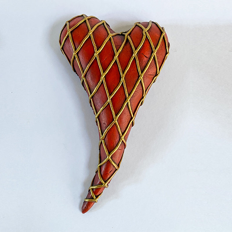 red clay heart with gold lattice