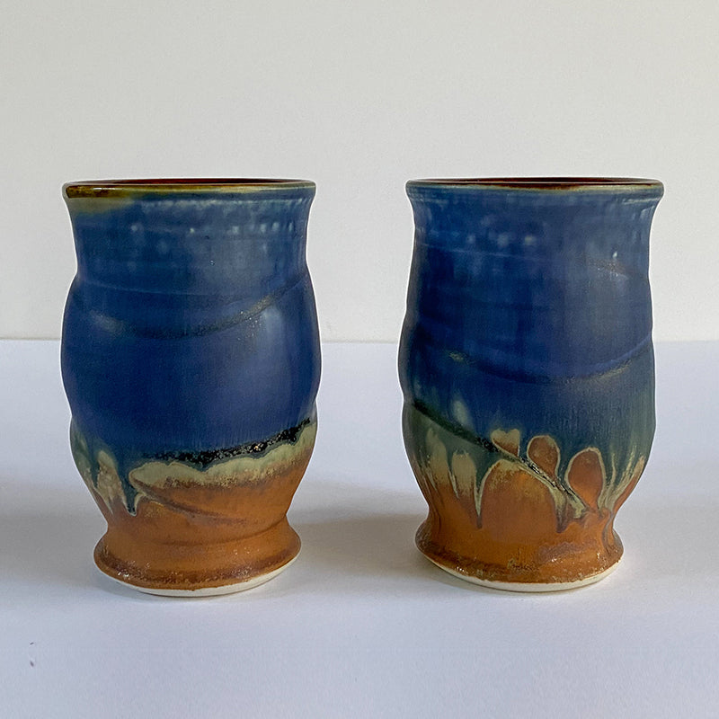 two blue and brown cups