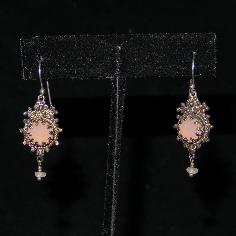 two pink earrings